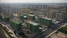 Най-задлъжнялата строителна компания в света свива наполовина загубата през първото полугодие