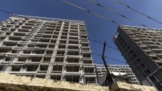 В Китай купувачи на жилища живеят в "гниещите си", незавършени имоти