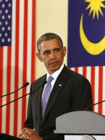 <p>
	Обама по време на посещението си в Малайзия. <em>Снимка: Ройтерс</em></p>
