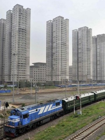 <p>
	Жилищни блокове в Китай. <em>Снимка: Ройтерс</em></p>
