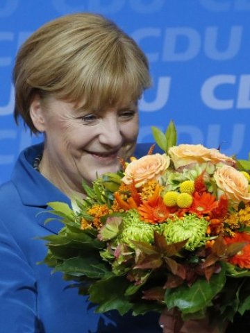 <p>
	Изборната победа на досегашния канцлер Ангела Меркел несъмнено ще има своето отражение върху пазарните движения. <em>Снимка: Ройтерс</em></p>
