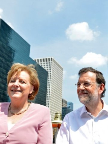 <p>
	<em>Испанският премиер Мариано Рахой и германският канцлер Ангела Меркел. Снимка: Ройтерс</em></p>
