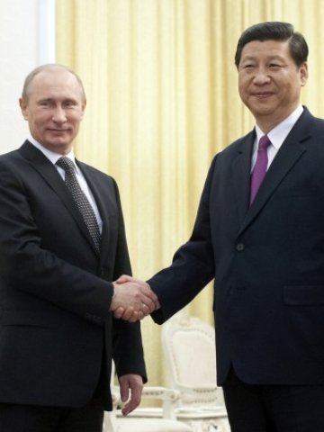 <p>
	<em>Китайският вицепрезидент Си Дзинпин и руският президент Владимир Путин. Снимка: Ройтерс</em></p>
