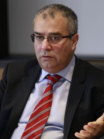 <p>
	Управителят на Централната банка на Кипър Паникос Димитриадес. <em>Снимка: Ройтерс</em></p>
