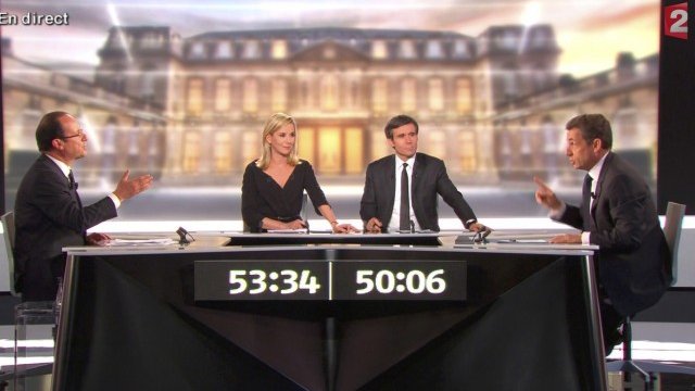 <p>
	Оланд и Саркози в телефизионното студио. Снимка: Ройтерс</p>
