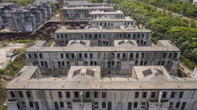 Заради забавяне на проекти стотици хиляди купувачи на жилища в Китай обявиха ипотечна стачка. Снимка: Bloomberg LP