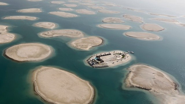 <p>
	Момент от строителството на Dubai World през 2012 г. <em>Снимка: архив Ройтерс</em></p>
