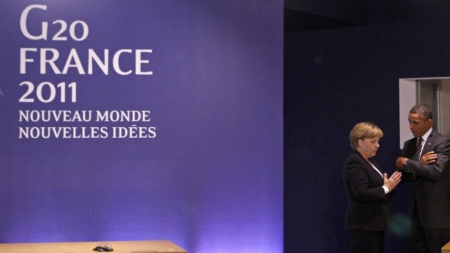 <p>
	Меркел и Обама в една от почивките на заседанието. <em>Снимка: Ройтерс</em></p>
