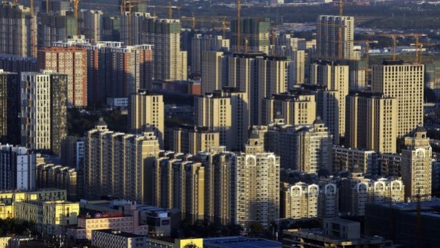 Ръстът на инвестициите в имоти в Китай се забави до 5-годишно дъно през 2014 г.