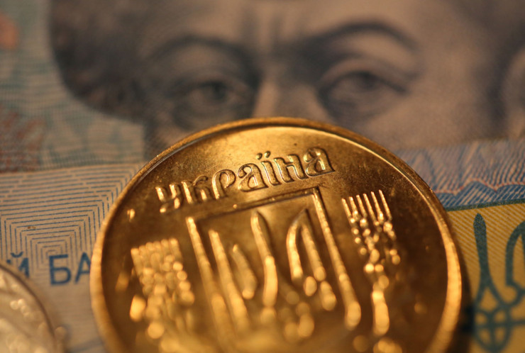 В началото на конфликта Украинската централна банка фиксира гривната с долара по курс от 29,25 гривни за долар. Снимка: Andrey Rudakov/Bloomberg	